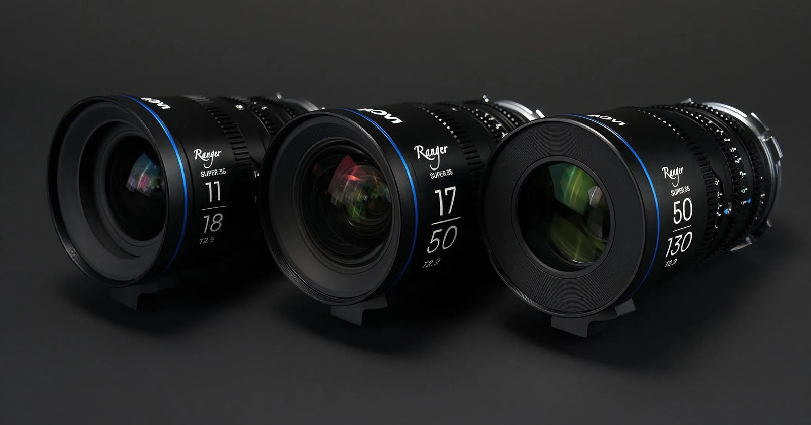 Three cinema lenses lined up, with focal lengths marked as 11mm, 17mm, and 50mm, displaying blue detailing against a dark background.