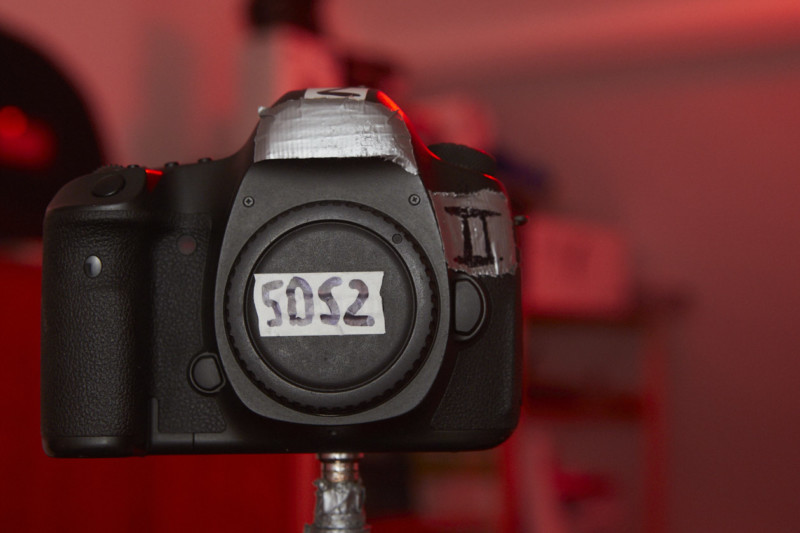 A DSLR camera on a tripod