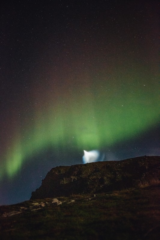 Bright light in the sky behind Northern Lights Bright light in the sky behind Northern Lights