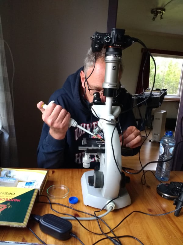 Jan van IJken using a microscope to photograph plankton Jan van IJken using a microscope to photograph plankton