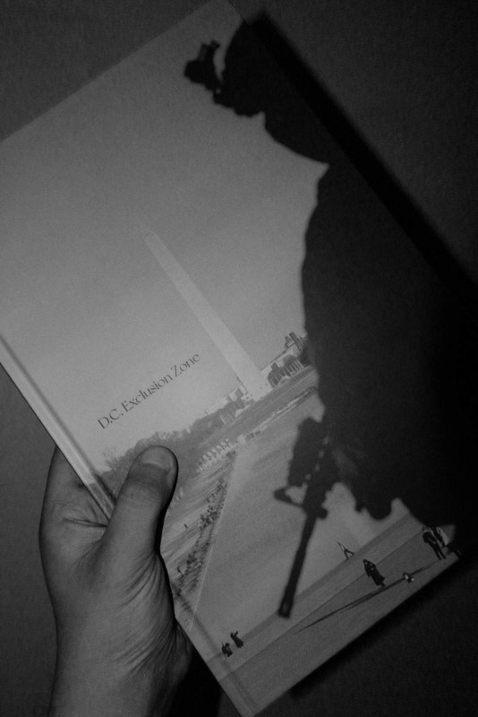 A hand holding a photo book A hand holding a photo book