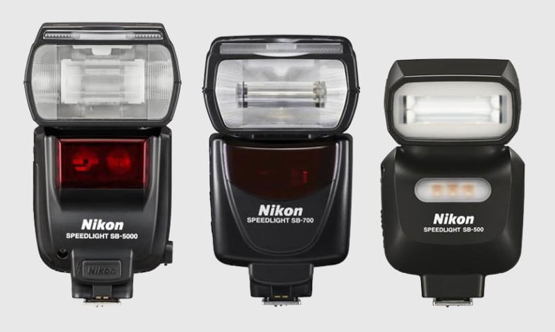 Three Nikon camera flashes.