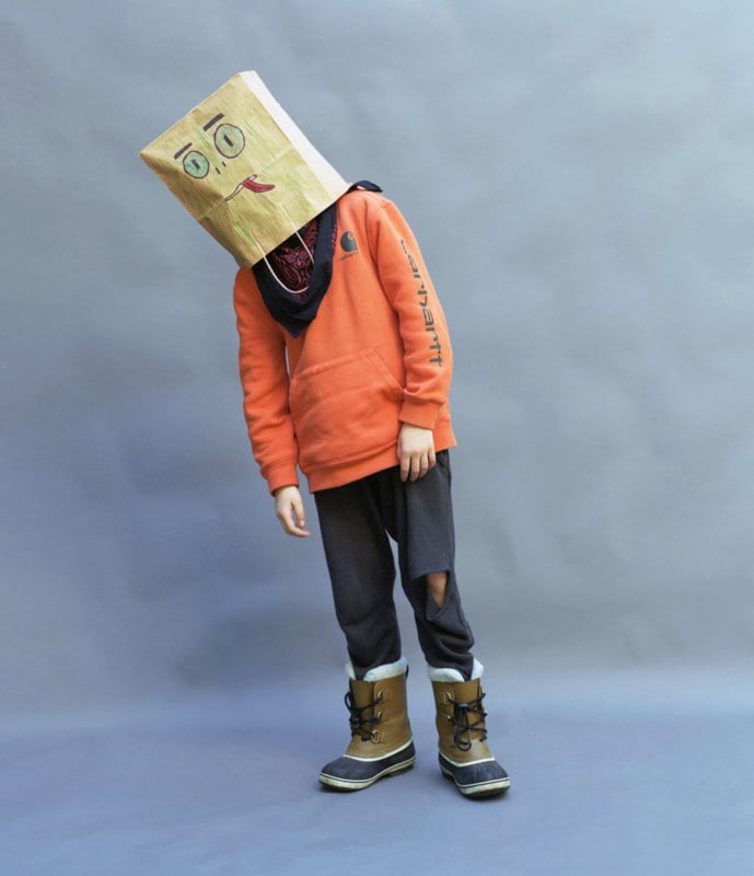 A person wearing a paper bag on their head