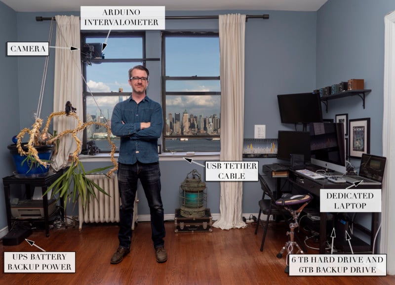 Photographer in his apartment with timelapse setup