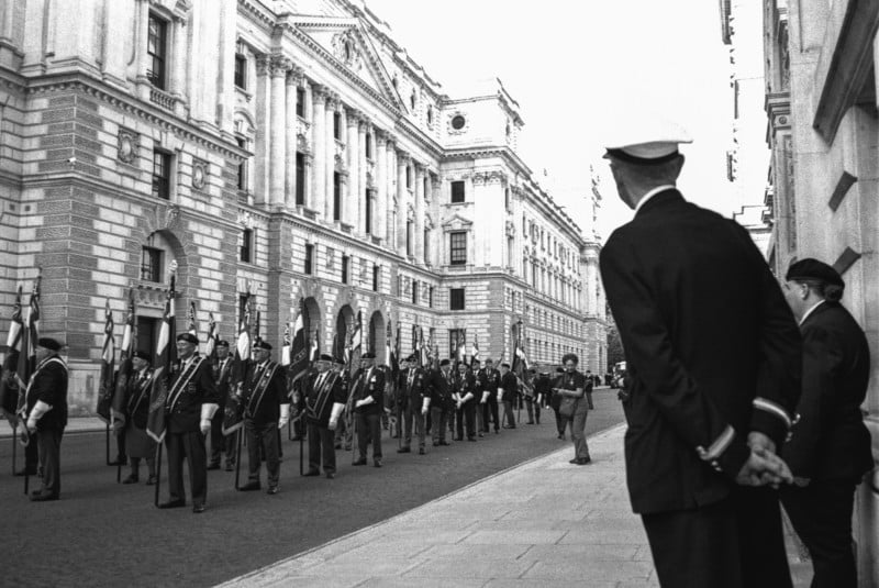 Onlookers watching a uniformed march