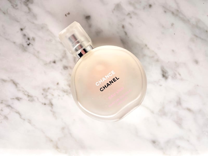 A product photo of a perfume bottle captured with a DIY softbox A product photo of a perfume bottle captured with a DIY softbox