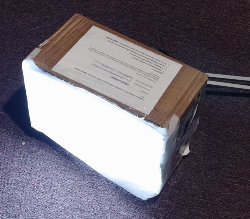 The DIY cardboard softbox with the light on The DIY cardboard softbox with the light on