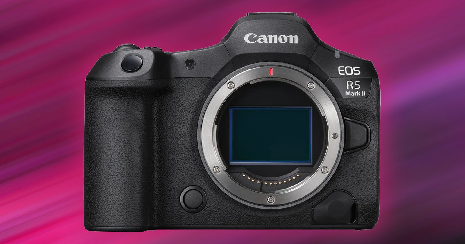 A Canon EOS R5 Mark II camera without a lens, showcasing the camera body and sensor. It has a textured grip on the left and various buttons on the top and front. The background features a gradient of pink and purple hues. A Canon EOS R5 Mark II camera without a lens, showcasing the camera body and sensor. It has a textured grip on the left and various buttons on the top and front. The background features a gradient of pink and purple hues.
