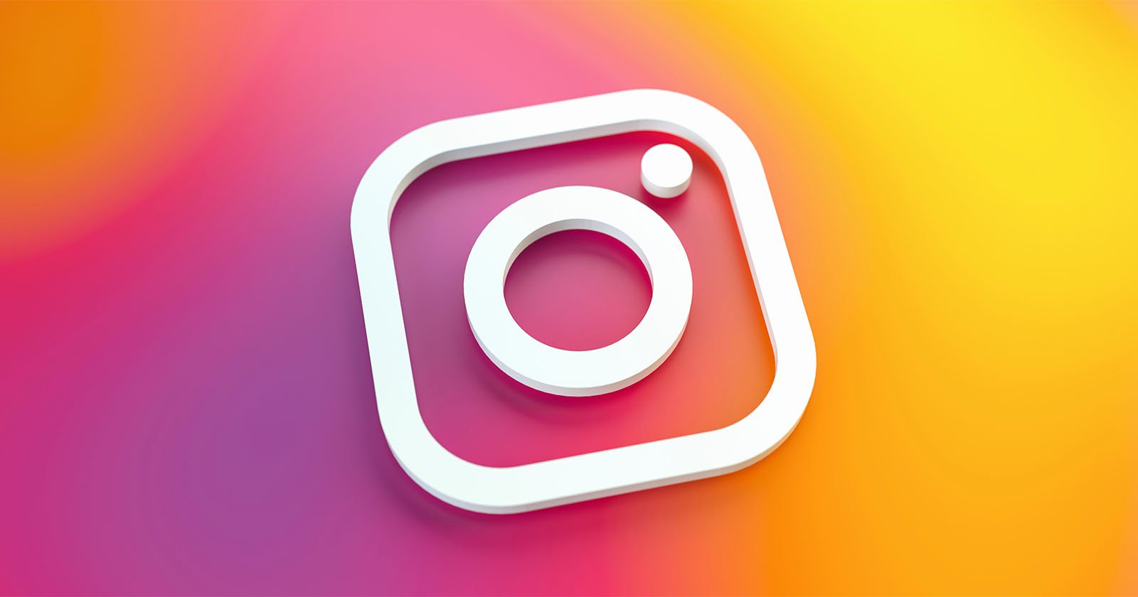 A white Instagram logo icon is displayed on a vibrant, gradient background blending pink, orange, and yellow colors. A white Instagram logo icon is displayed on a vibrant, gradient background blending pink, orange, and yellow colors.