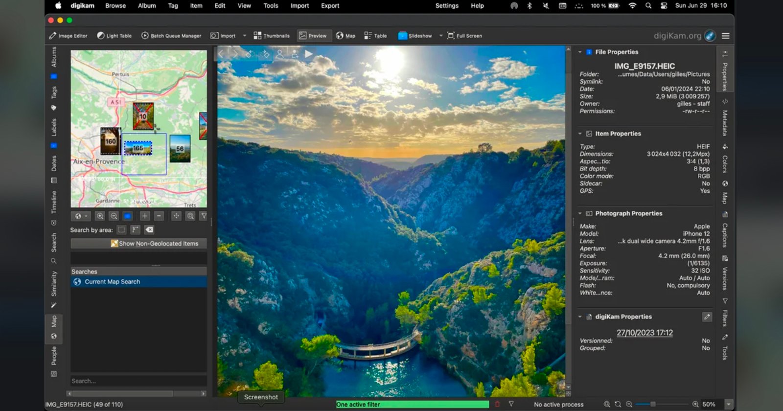 A screenshot of a photo editing software showing a vivid image of a river canyon at sunset, with steep cliffs, green trees, bright blue water, and a curved dam, alongside editing tools, photo info, and a map preview. A screenshot of a photo editing software showing a vivid image of a river canyon at sunset, with steep cliffs, green trees, bright blue water, and a curved dam, alongside editing tools, photo info, and a map preview.