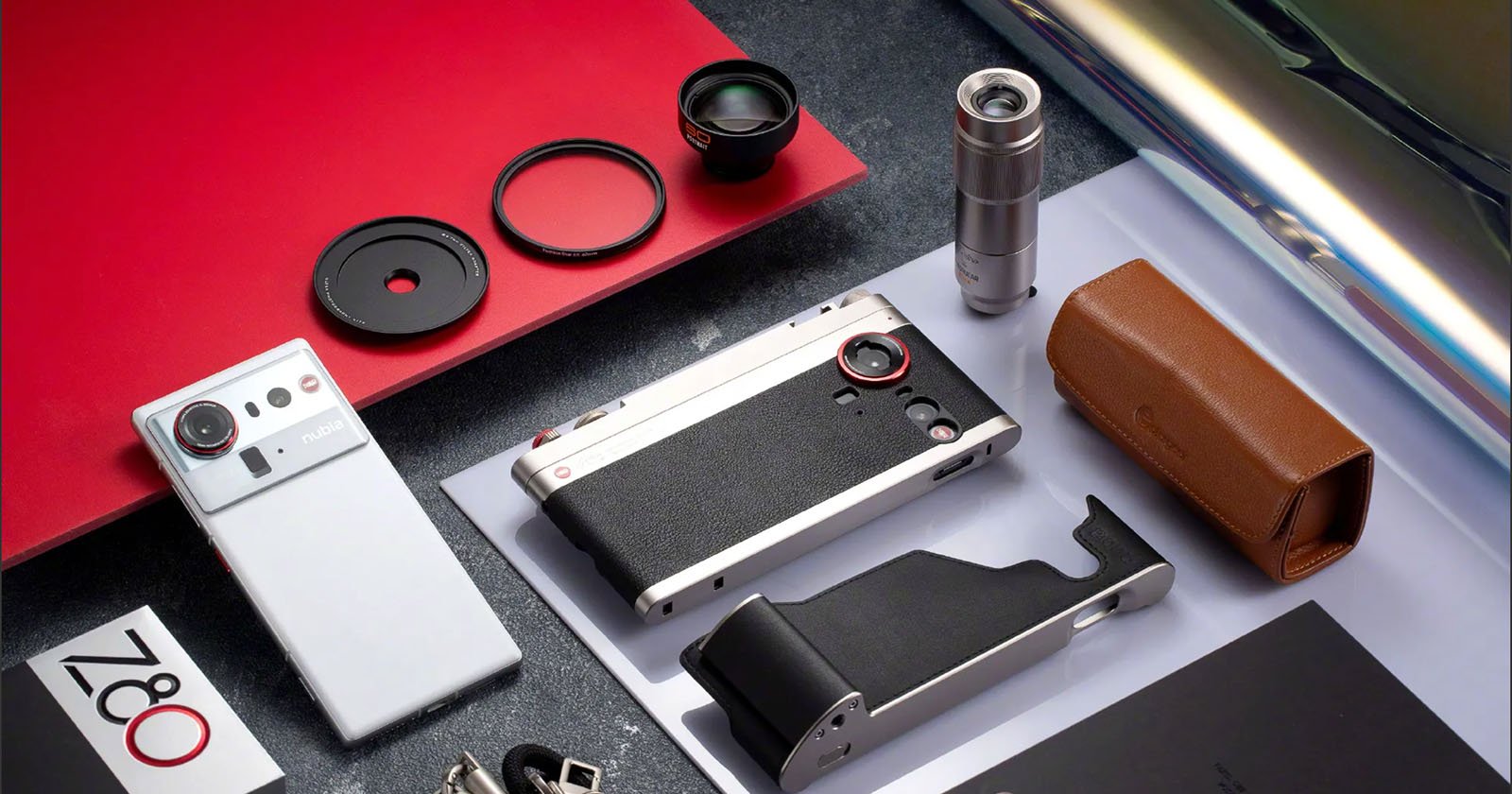 A flat lay photo of a stylish camera with accessories, including lenses, filters, a grip, a leather case, a strap, a metallic tube, and a box labeled “Z80,” all arranged on a surface with red and white paper. A flat lay photo of a stylish camera with accessories, including lenses, filters, a grip, a leather case, a strap, a metallic tube, and a box labeled “Z80,” all arranged on a surface with red and white paper.